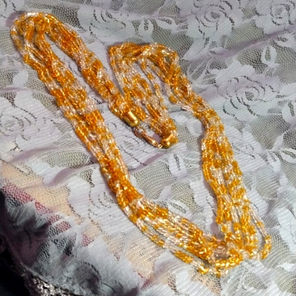 Multi-strand gold beaded necklace